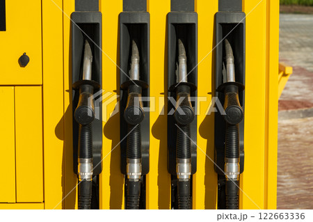 Fuel pumps station close up. Petrol pump filling nozzles at gas station 122663336