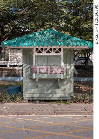 Front view of Security guard olive green booth (Guardhouse) in public park. 122666390