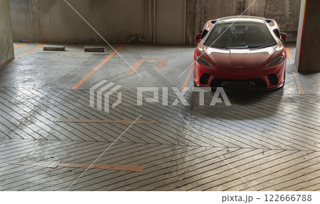 Ferrari red sports car parked in the parking lot. 122666788