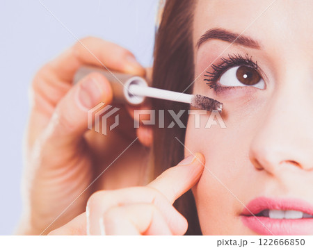Woman getting make up done by artist Woman getting make up done by artist 122666850