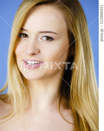 Portrait of happy blonde woman smiling with joy 122666851