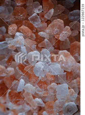 Close-up view of Pink Himalayan Salt on Bright colors textured surface. 122667139