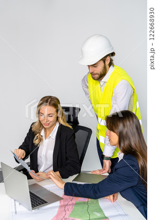 Group of people discussing new project details in the office Group of people discussing new project details in the office 122668930
