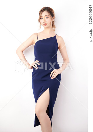 Beautiful face of young Asian woman in sexy dress Blue Perfect slim body on white background, plastic surgery and aesthetic cosmetology, Facial and skin care concept Beautiful face of young Asian woman in sexy dress Blue Perfect slim body on white background, plastic surgery and aesthetic cosmetology, Facial and skin care concept 122669847