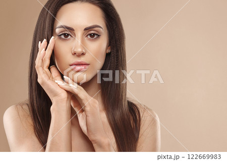 Portrait of female hands with manicure nails. Care for hands and nails and cosmetics. Copyspace. Portrait of female hands with manicure nails. Care for hands and nails and cosmetics. Copyspace. 122669983
