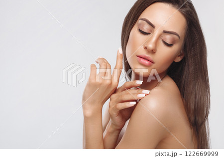 Portrait of female hands with manicure nails.  Care for hands and nails and cosmetics. Copyspace. 122669999