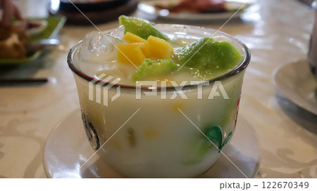 Es Teler Avocado and Jackfruit, Indonesian delight with shaved ice, avocado, coconut, grass jelly, in a blend of coconut milk, condensed milk, pandan syrup, sugar. Sweet, fresh, and creamy. 122670349