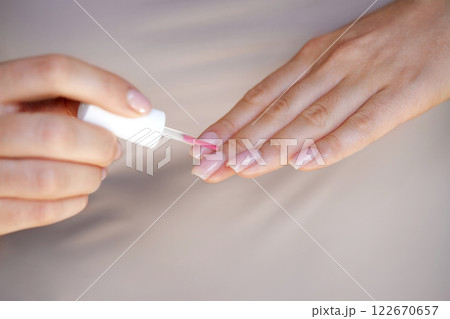 Nail Care And Manicure. Closeup Of Beautiful Female Hands Applying Transparent Nail Polish On Healthy Natural Woman's Nails 122670657