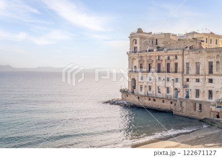 Naples coastline, historic buildings, Mediterranean Sea. 122671127