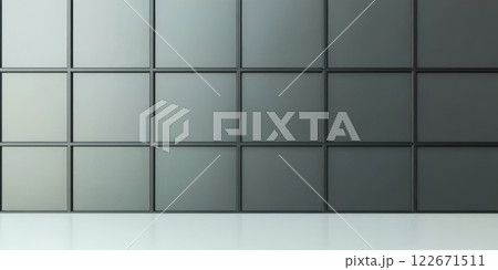 Modern interior wall featuring a grid of square panels in various shades of gray 122671511