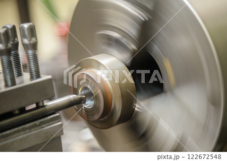 The lathe machine bore cutting the metal shaft parts. The lathe machine bore cutting the metal shaft parts. 122672548