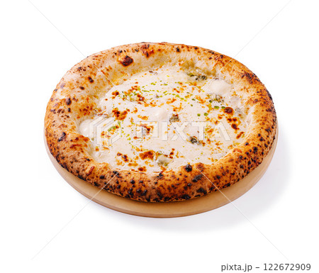 Delicious cheese pizza topped with herbs fresh out of the oven on a wooden platter 122672909