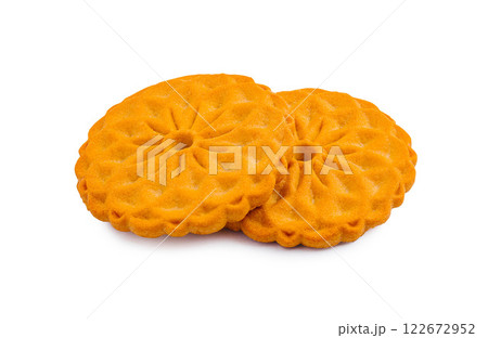 Delicious orange cookies with a floral design on a clean white background perfect for snacks or desserts 122672952