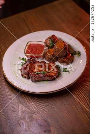 Beautiful restaurant dish golden potatoes and 122674258