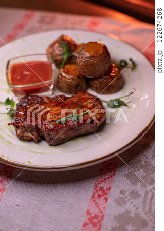 Beautiful restaurant dish golden potatoes and 122674268