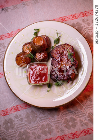 Beautiful restaurant dish golden potatoes and 122674279