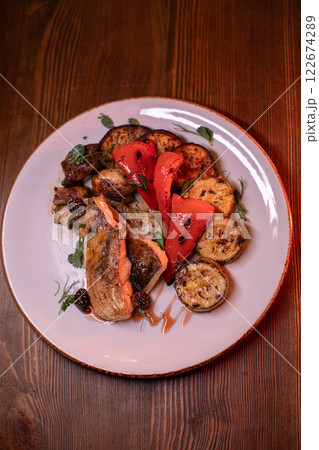 Restaurant dish fish with vegetables: zucchini Restaurant dish fish with vegetables: zucchini 122674289