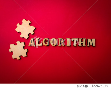 Closeup wooden word and wooden puzzle with the word ALGROITHM on a red background. 122675059