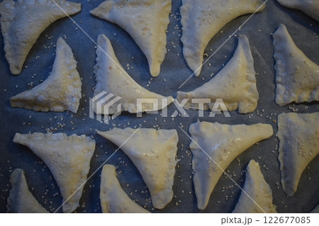 Ready to Bake: A Tray of Golden Pastries with Sesame Seeds Ready to Bake: A Tray of Golden Pastries with Sesame Seeds 122677085