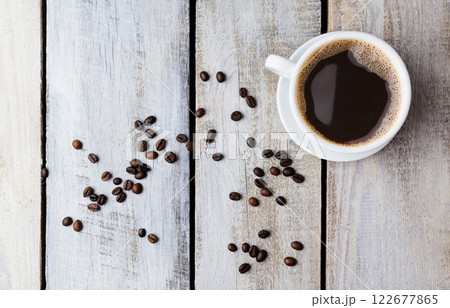 Cup of coffee and coffee grains.Texture of coffee beans.Top view. Copyspace. Morning coffee. Break. Lunch, snack, Relax 122677865