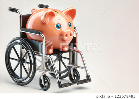 Piggy bank in a wheelchair. Space for text. 122679493