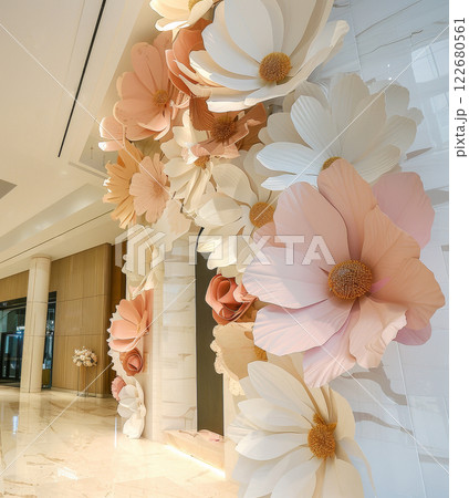 Event decor installation made with white, pink, and beige flowers in the shape of giant petals for a wedding or brand concept branding experience Event decor installation made with white, pink, and beige flowers in the shape of giant petals for a wedding or brand concept branding experience 122680561