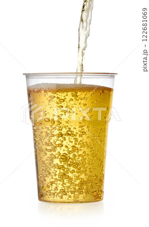 fresh apple juice pouring in to glass fresh apple juice pouring in to glass 122681069