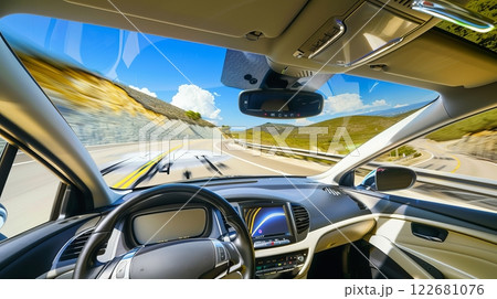 A trip on a picturesque mountain road on an unmanned car. A trip on a picturesque mountain road on an unmanned car. 122681076