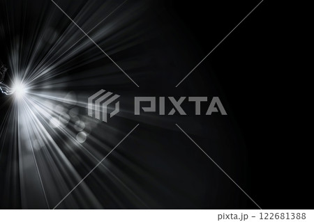Abstract light burst on dark background with glowing rays and particles Abstract light burst on dark background with glowing rays and particles 122681388