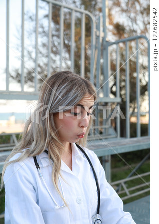 Surprised Woman While Chatting On A Smartphone Surprised Woman While Chatting On A Smartphone 122682542