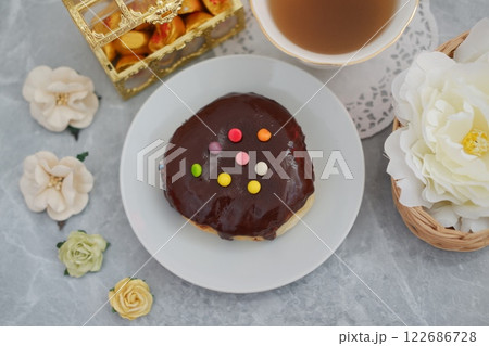 donut and cup on the marble table 122686728