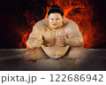 勝負を賭けたお相撲さんの闘志の炎が燃え上がる 122686942