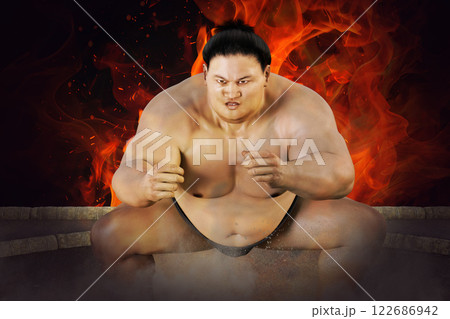 勝負を賭けたお相撲さんの闘志の炎が燃え上がる 勝負を賭けたお相撲さんの闘志の炎が燃え上がる 122686942
