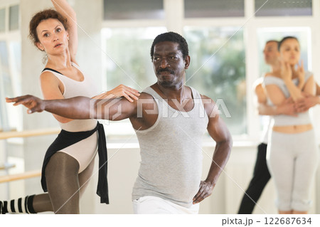 Adult man and adult woman rehearsing pair ballet Adult man and adult woman rehearsing pair ballet 122687634