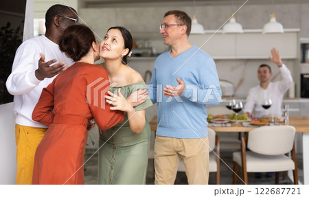 Group of friends greeting each other Group of friends greeting each other 122687721