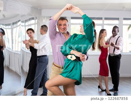 Man and woman dancing waltz in couple during lesson at studio 122687858