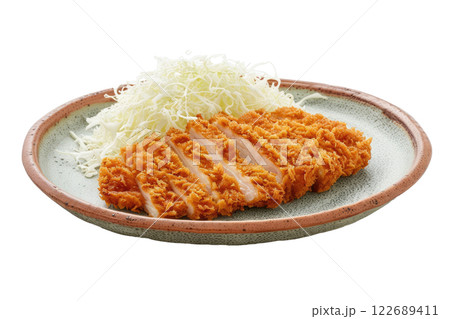 plate of tonkatsu with shredded cabbage, isolated background 122689411