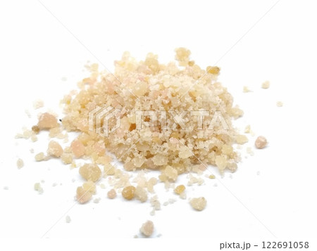 A picture of asafoetida powder isolated on a white background A picture of asafoetida powder isolated on a white background 122691058