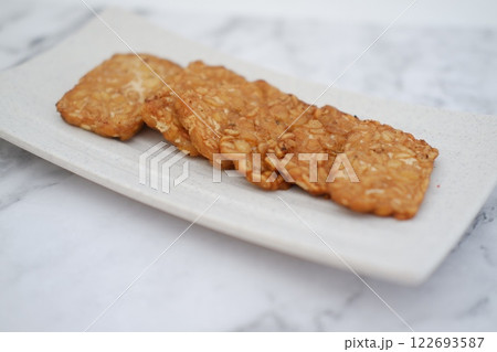 Fried tempeh is a popular Indonesian dish made from tempeh 122693587