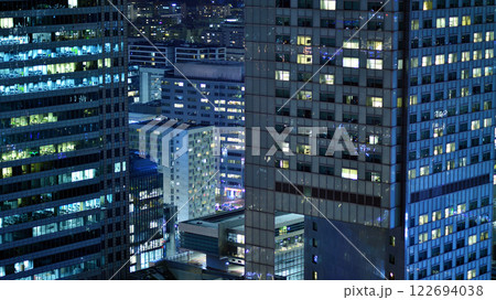 Aerial photography of modern architectural landscapes at night. Lights in the windows of buildings. The blue color of twilight. 122694038