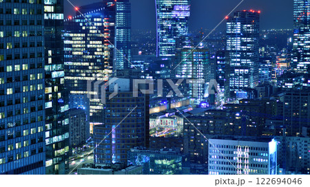 Aerial photography of modern architectural landscapes at night. Lights in the windows of buildings. The blue color of twilight. Aerial photography of modern architectural landscapes at night. Lights in the windows of buildings. The blue color of twilight. 122694046