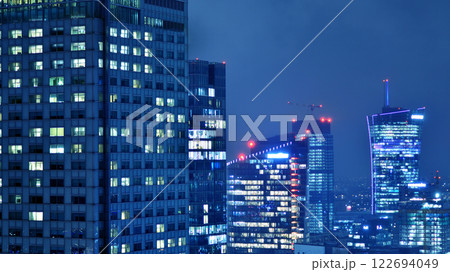 Aerial photography of modern architectural landscapes at night. Lights in the windows of buildings. The blue color of twilight. Aerial photography of modern architectural landscapes at night. Lights in the windows of buildings. The blue color of twilight. 122694049