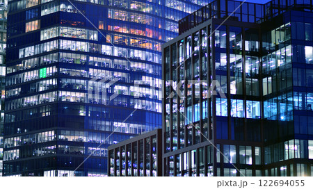 Aerial photography of modern architectural landscapes at night. Lights in the windows of buildings. The blue color of twilight. Aerial photography of modern architectural landscapes at night. Lights in the windows of buildings. The blue color of twilight. 122694055