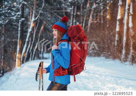 Woman Traveler with backpack hiking Travel Lifestyle adventure concept active vacations outdoor. Beautiful landscape forest 122695523
