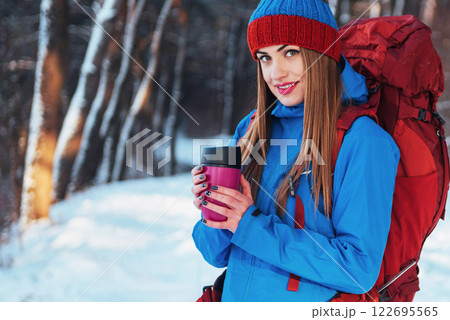 Woman Traveler with backpack hiking Travel Lifestyle adventure concept active vacations outdoor. Beautiful landscape forest 122695565