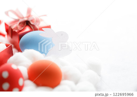 Happy Easter eggs and gift boxes on white background. Easter decoration. 122695966