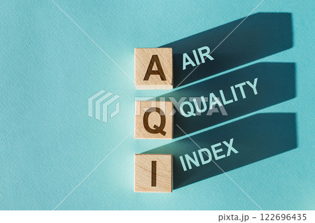 AQI Abbreviation of air quality index text on wooden cubes on blue background. 122696435