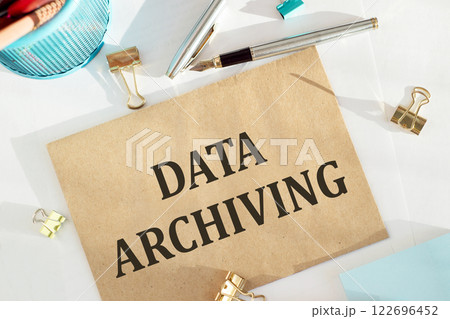 Cravt envelope with DATA ARCHIVING note on the office desk, concept. 122696452