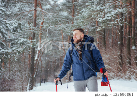 Man Traveler with backpack hiking Travel Lifestyle adventure concept active vacations outdoor. Beautiful landscape forest Man Traveler with backpack hiking Travel Lifestyle adventure concept active vacations outdoor. Beautiful landscape forest 122696861