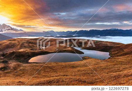 Sunset on mountain lake Koruldi. Upper Svaneti, Georgia, Europe. Caucasus mountains Sunset on mountain lake Koruldi. Upper Svaneti, Georgia, Europe. Caucasus mountains 122697278